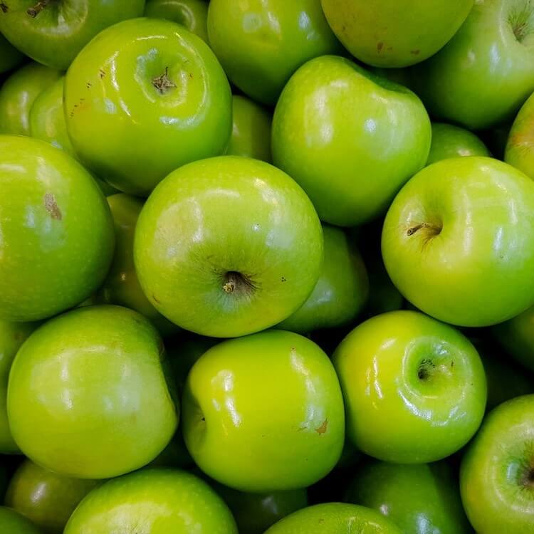 An photo of many green apples