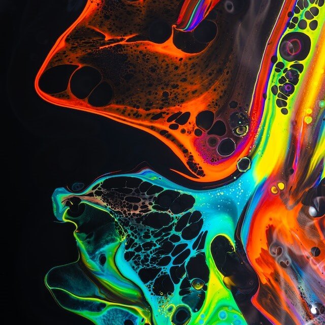 An photo of multicoloured oil-on-water shapes